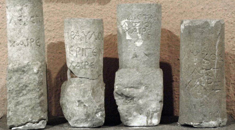 Ancient stone pillars featuring carved inscriptions, dated to the 2nd century BC, discovered in Durrës and housed in the Archaeological Museum of Tirana, Albania